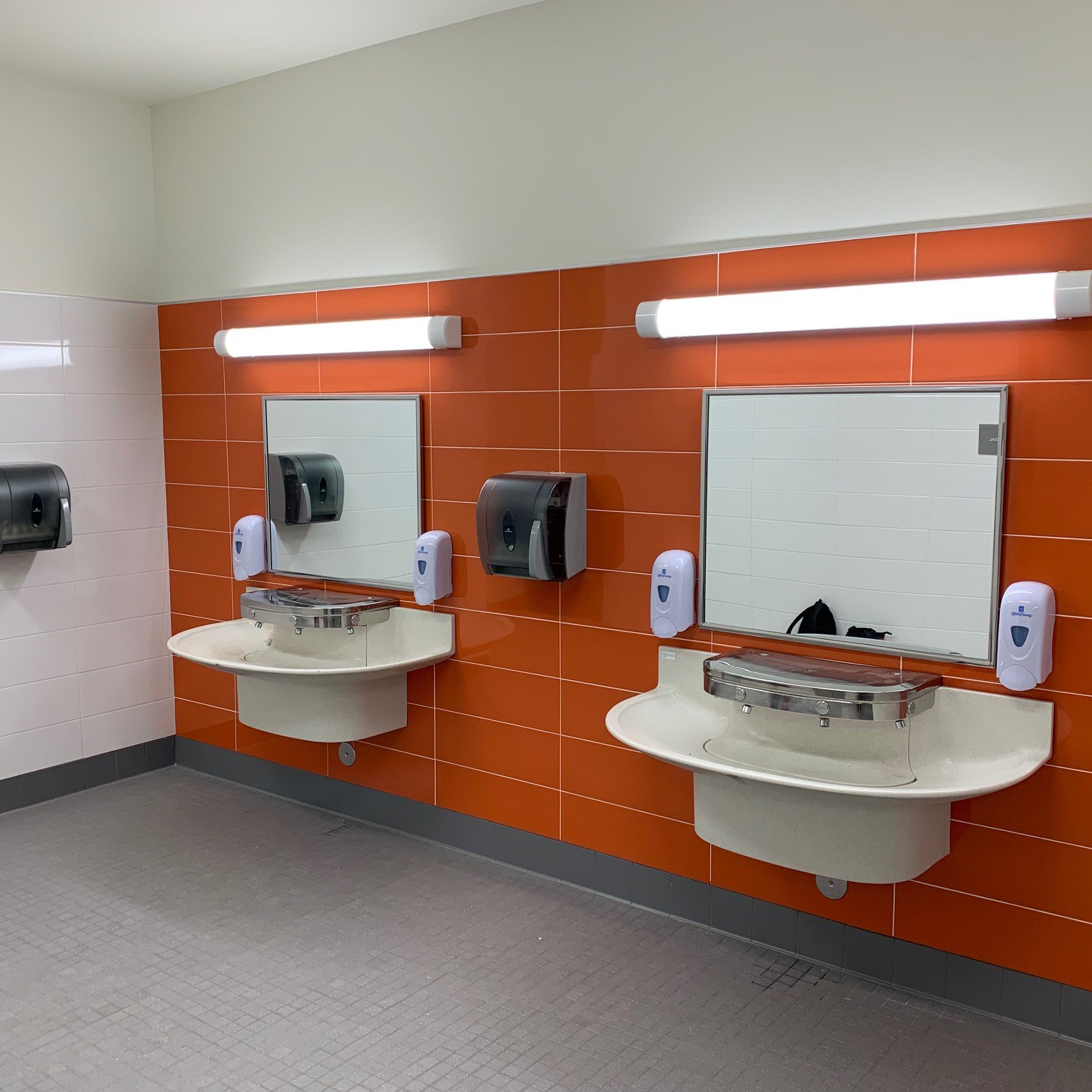 public restroom with two 4-user sanifount washfountain