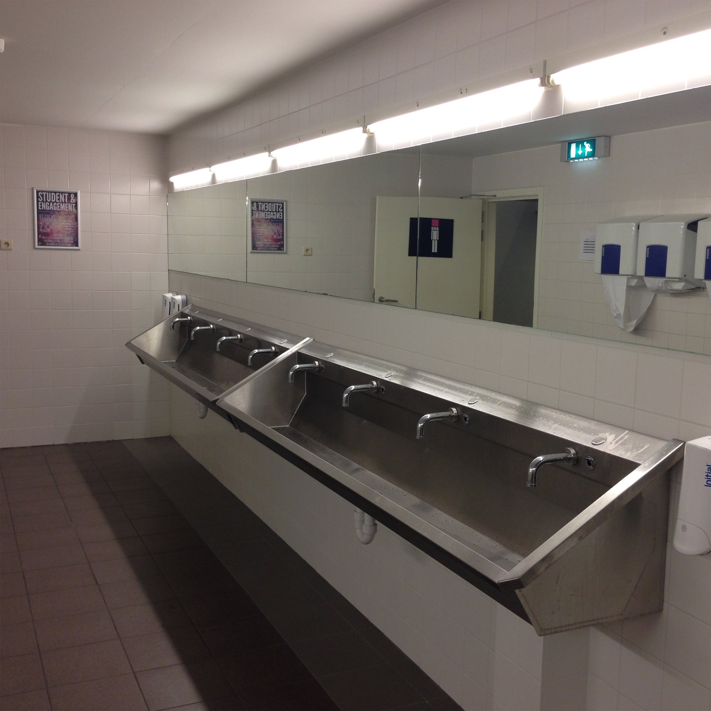 public restroom with two line1 4-user wash basins with sensor faucets