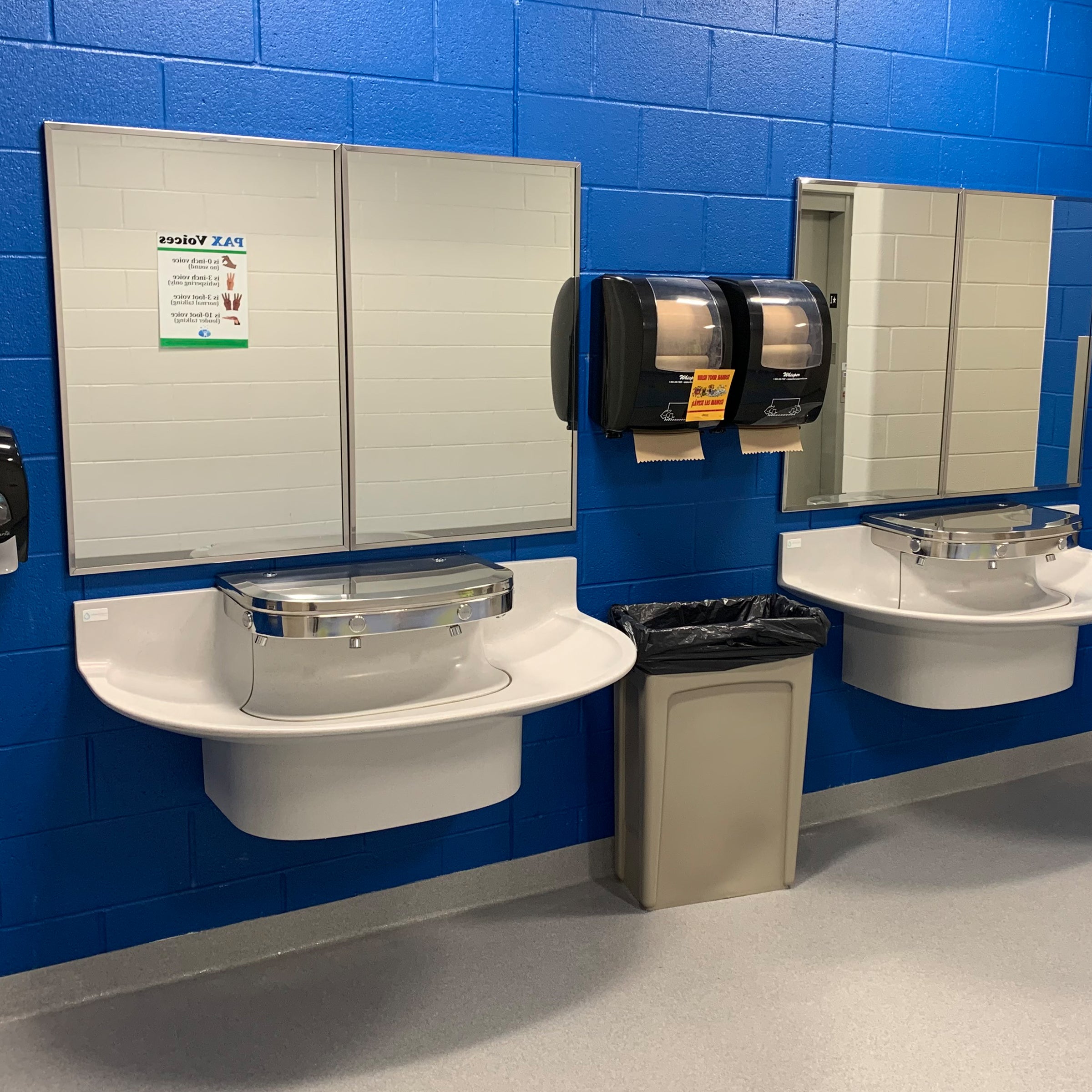 public restroom with two  4-user sanifount washfountains
